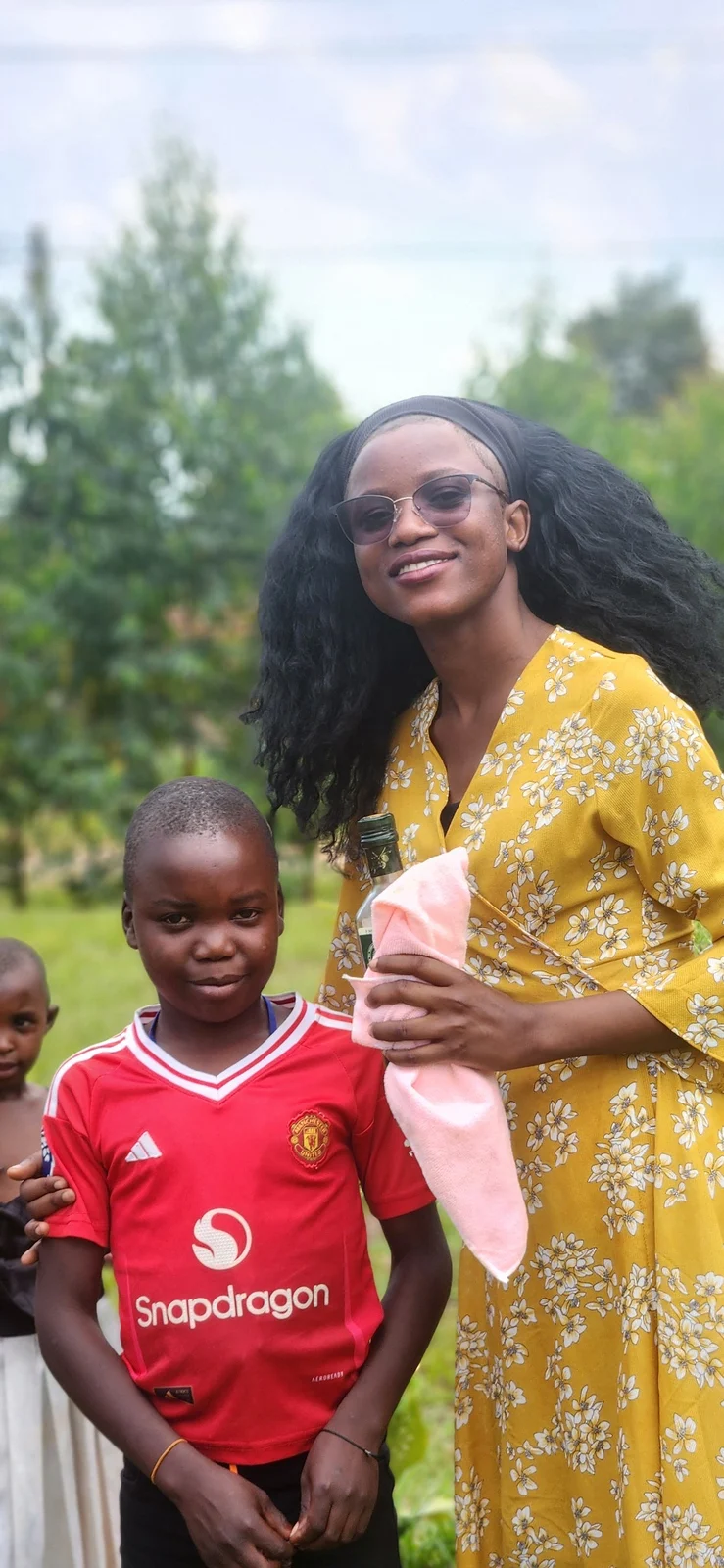 A KRF team member engaging with a child in Semuto.