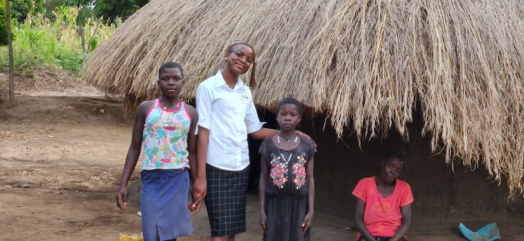 Children and a caregiver photographed during a home support visit.