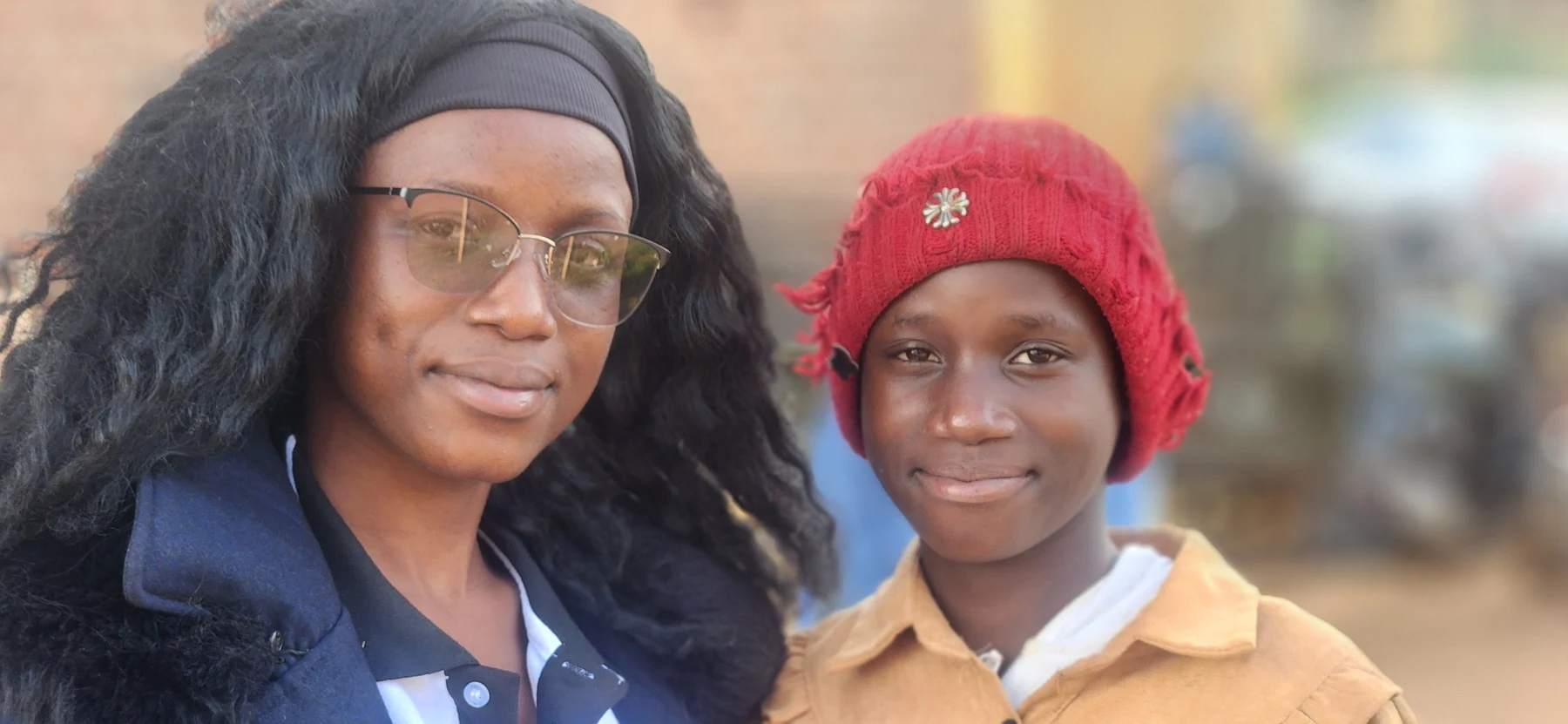 A supportive KRF moment with a young participant.