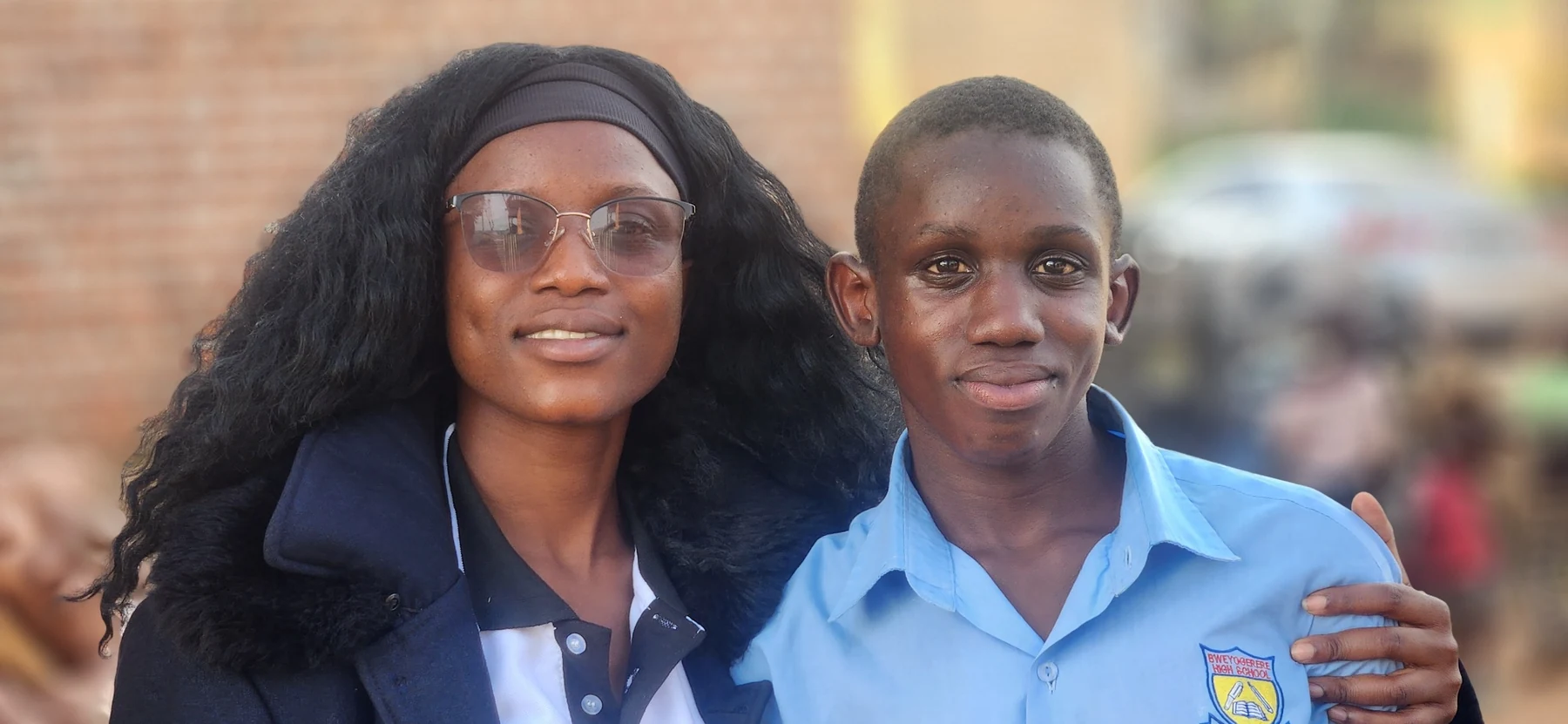 A KRF team member with a student during community engagement.