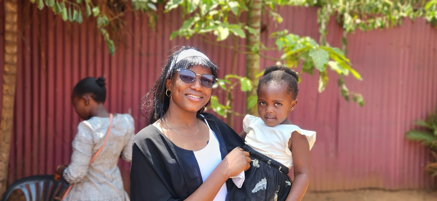 A caring moment with a young child during community outreach.