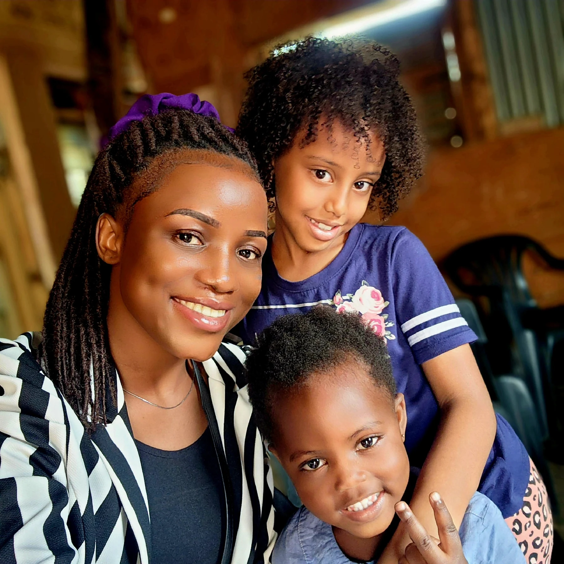 A warm community moment with children during KRF engagement.