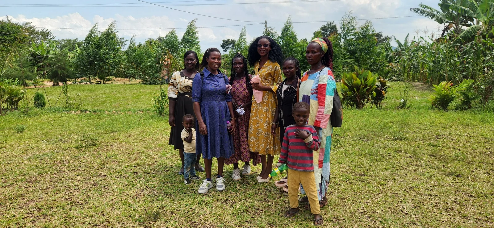 KRF team members with women and children during a community visit.