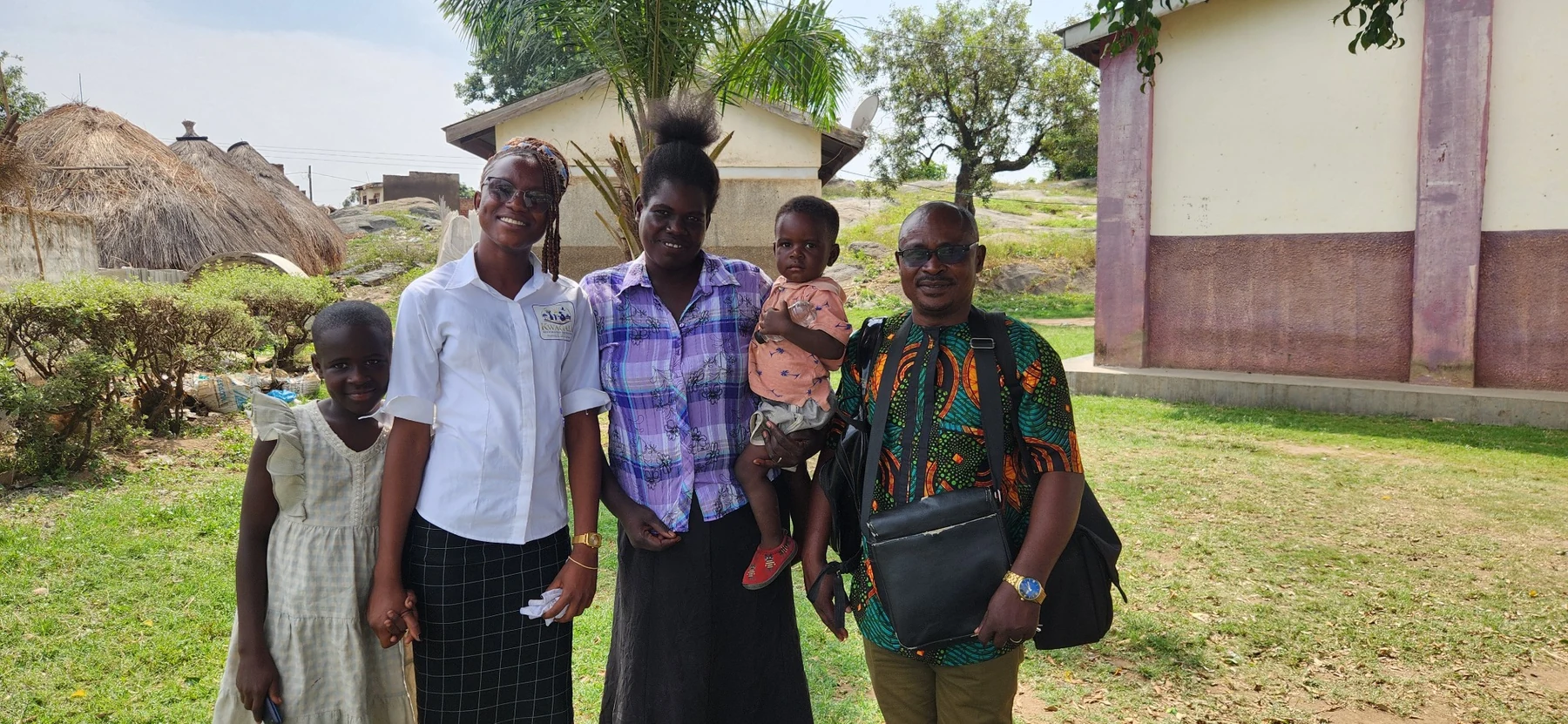 A family group photographed during a KRF community support visit.