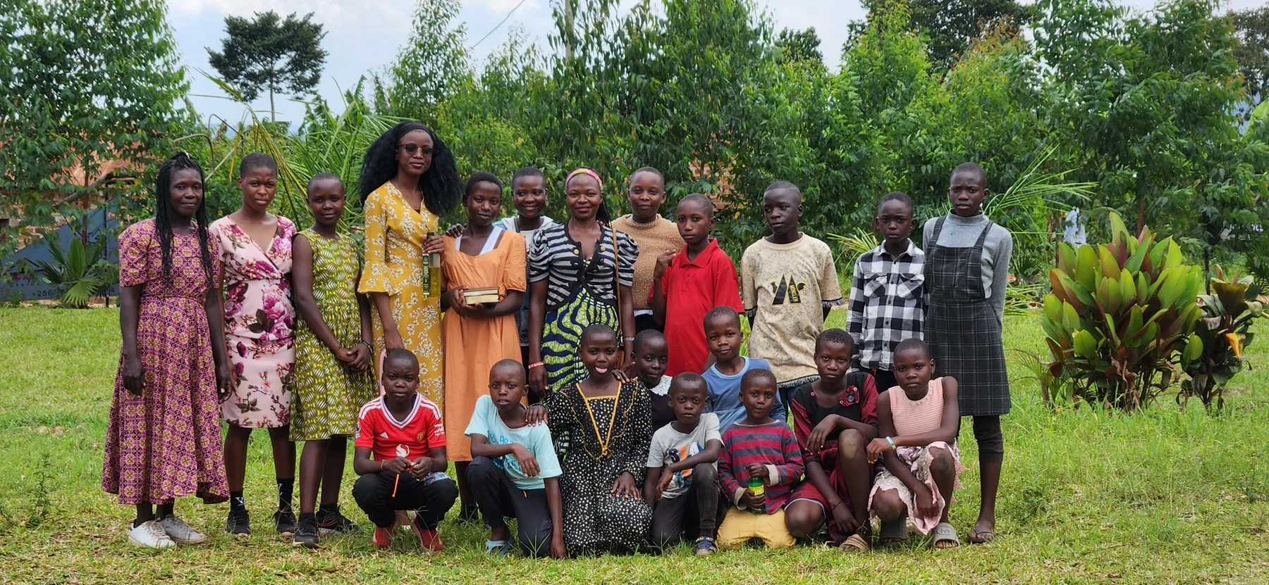 A group portrait with children, caregivers and KRF participants.