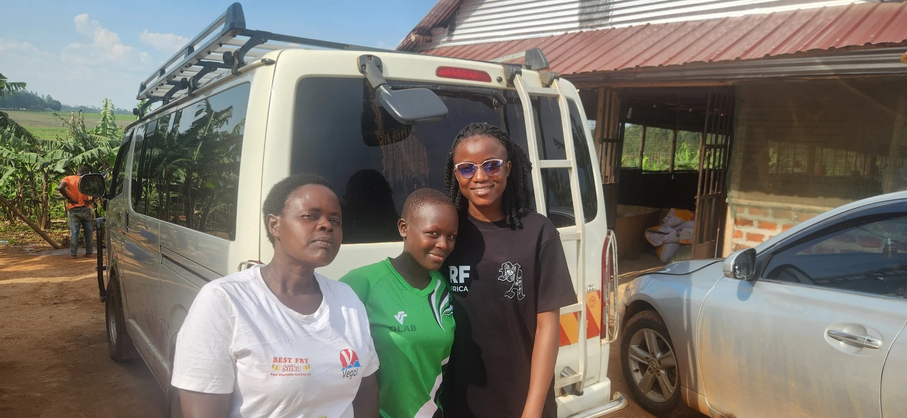 A field outreach moment with community members and a young person.