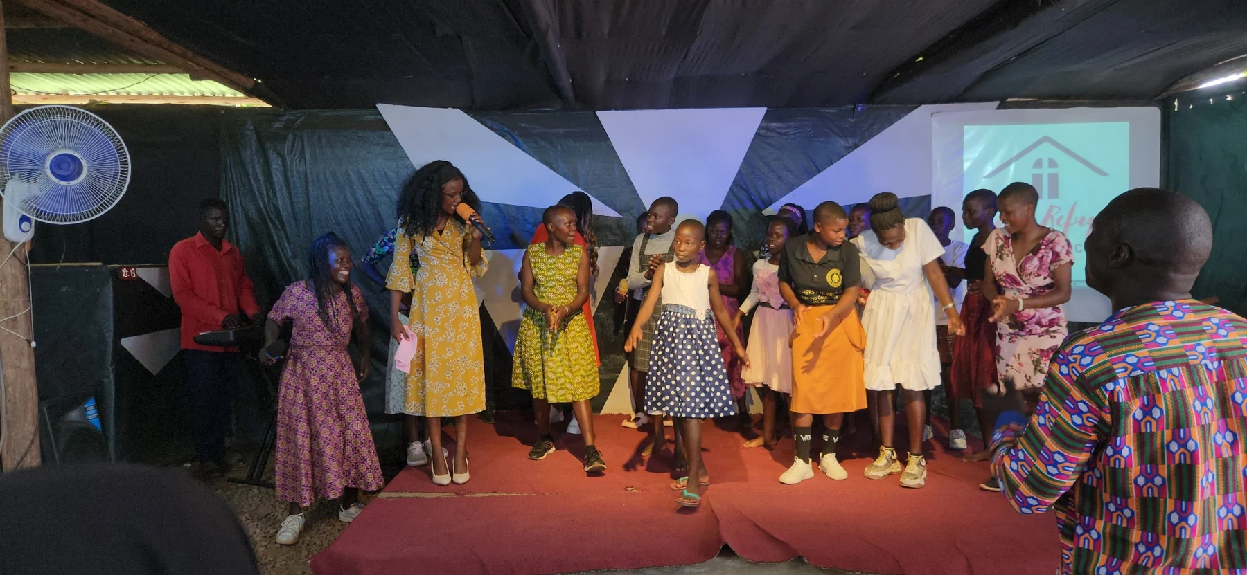 Children and young people participating together during a programme event.