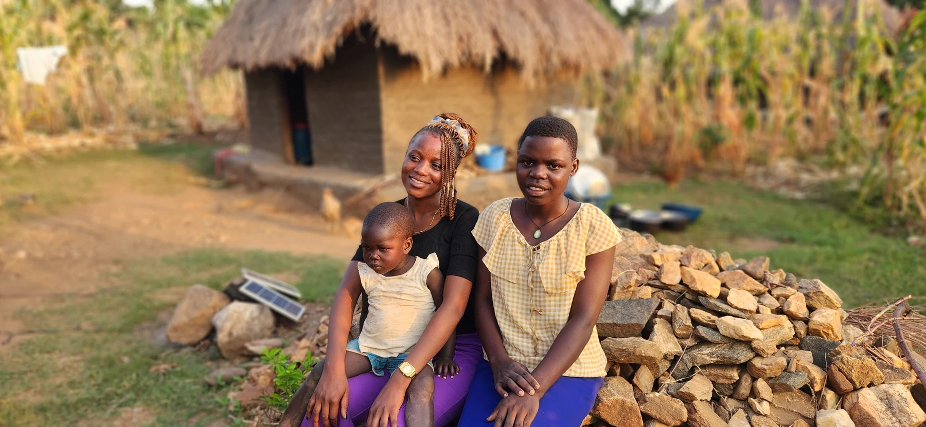 A family-centred outreach moment during a village home visit.