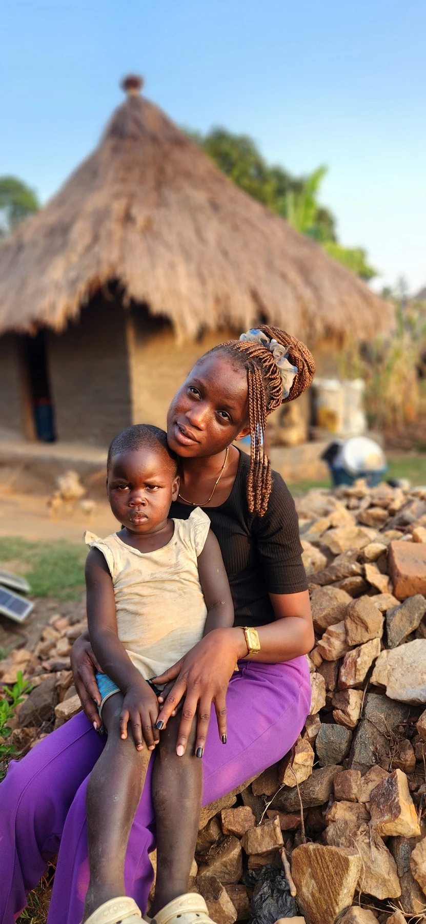 A child-centred home visit during rural community outreach.