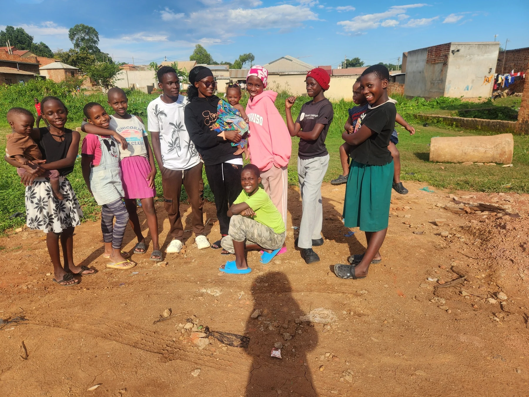 Young people and children gathered during a KRF community visit.